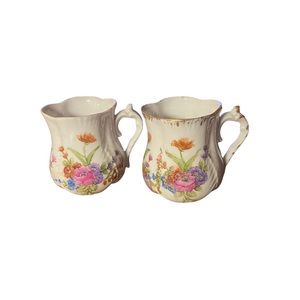 Pair of Antique dainty porcelain tea cups. hand painted? some gold trim.